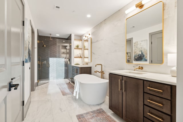 bathroom with tile walls, shower with separate bathtub, and vanity