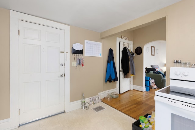 foyer entrance with light hardwood / wood-style floors