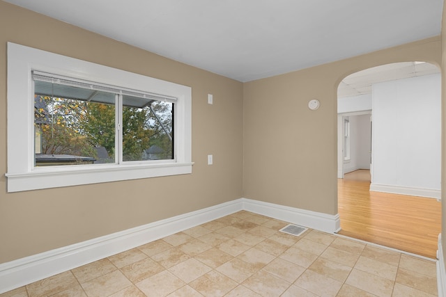 unfurnished room with light hardwood / wood-style flooring