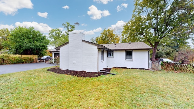 view of home's exterior featuring a lawn