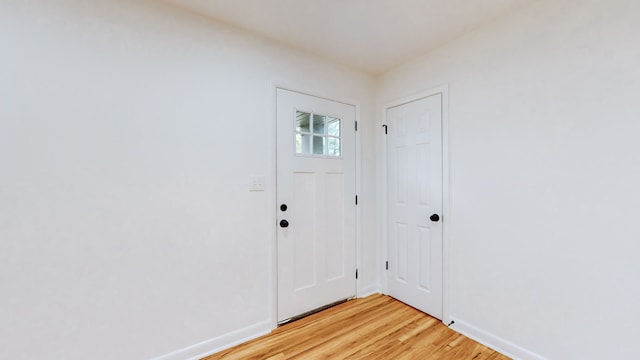 foyer with light hardwood / wood-style floors