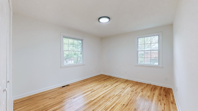 empty room with wood-type flooring