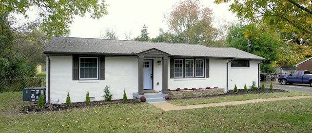 ranch-style house with a front lawn