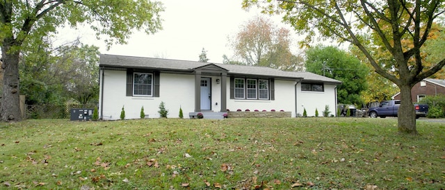 ranch-style house featuring a front yard