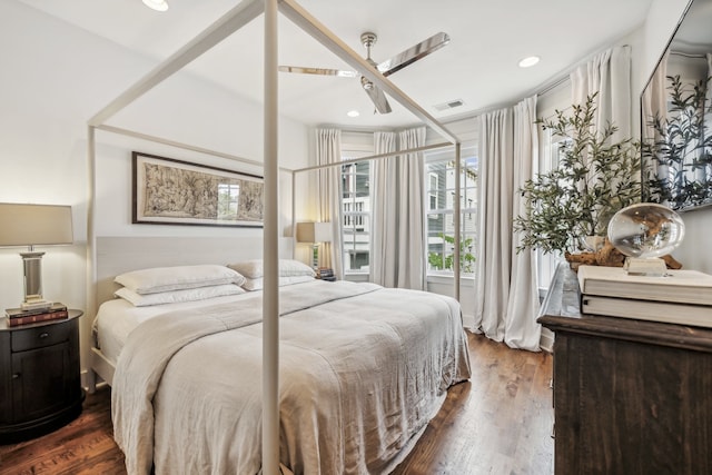 bedroom with dark wood-type flooring and ceiling fan