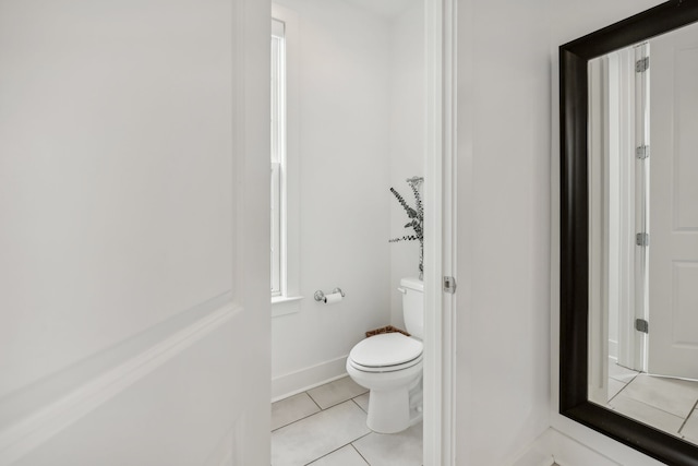 bathroom with tile patterned flooring and toilet