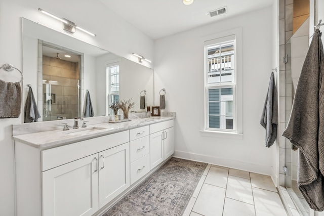 bathroom with vanity, tile patterned floors, and a shower with shower door