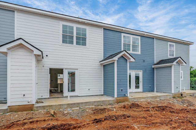 rear view of property featuring a patio