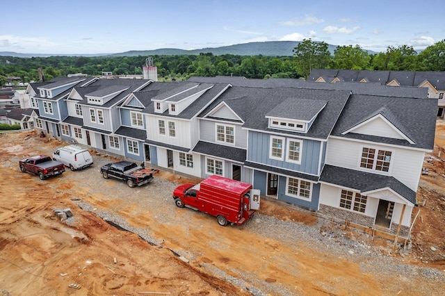 birds eye view of property with a mountain view