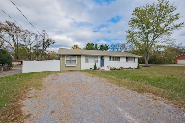 single story home featuring a garage and a front lawn