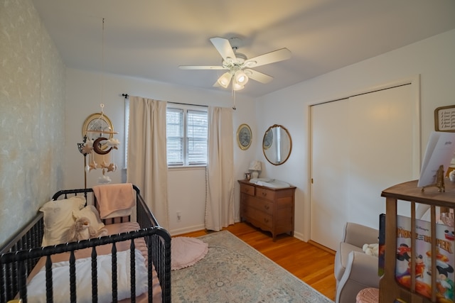 bedroom featuring ceiling fan and light hardwood / wood-style floors