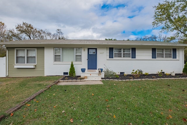 ranch-style home with a front lawn