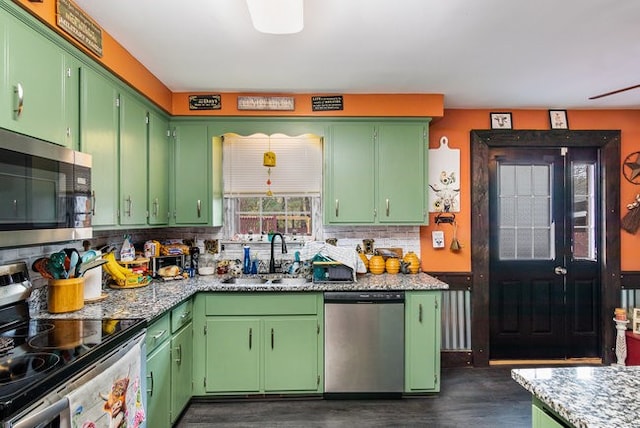 kitchen with sink, green cabinetry, and stainless steel appliances