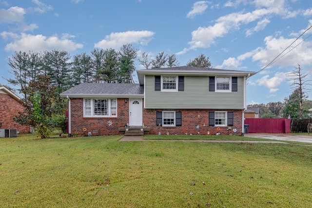 split level home featuring a front lawn