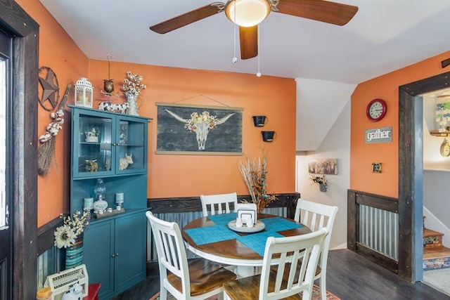 dining area featuring ceiling fan, lofted ceiling, and dark hardwood / wood-style floors