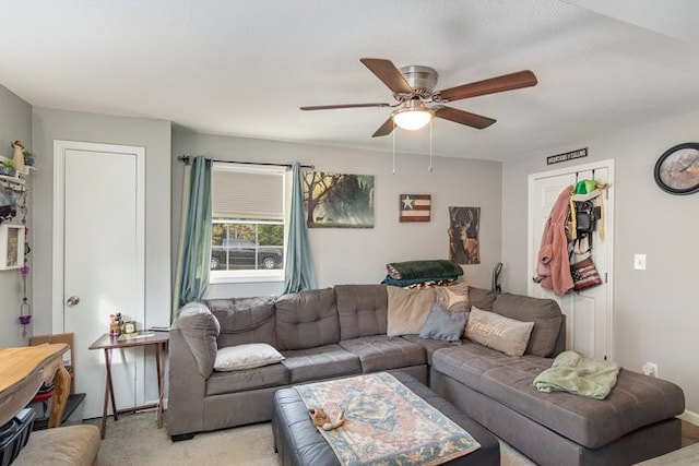 living room featuring light carpet and ceiling fan