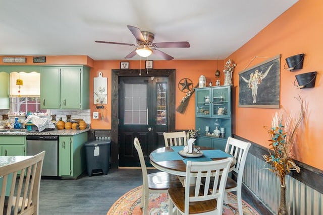 dining space featuring ceiling fan and dark hardwood / wood-style flooring