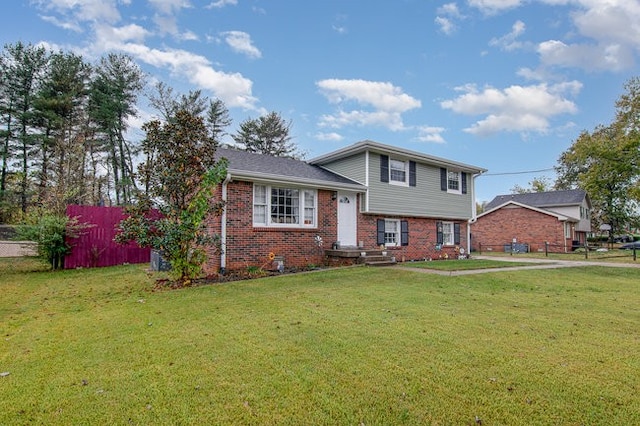 split level home with a front yard