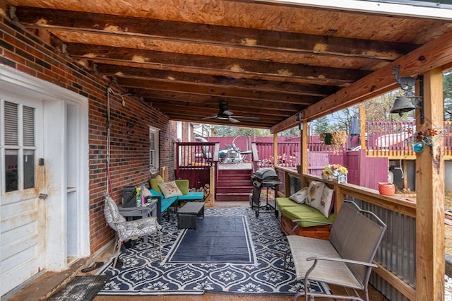 view of patio featuring area for grilling and ceiling fan