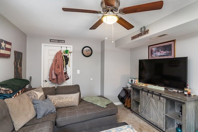 carpeted living room featuring ceiling fan