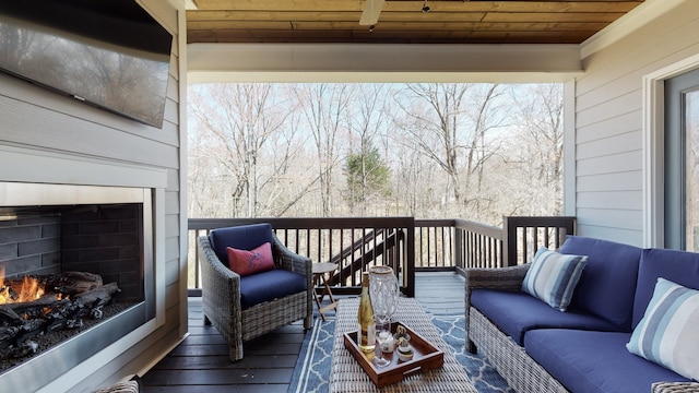 wooden deck featuring an outdoor hangout area