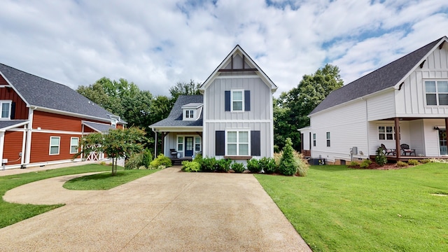 view of front of home featuring covered porch and a front yard