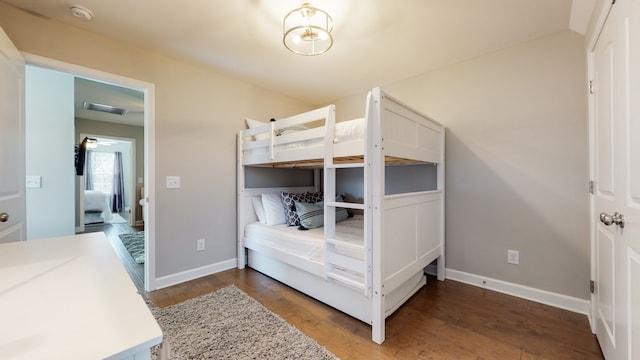 unfurnished bedroom featuring dark hardwood / wood-style flooring