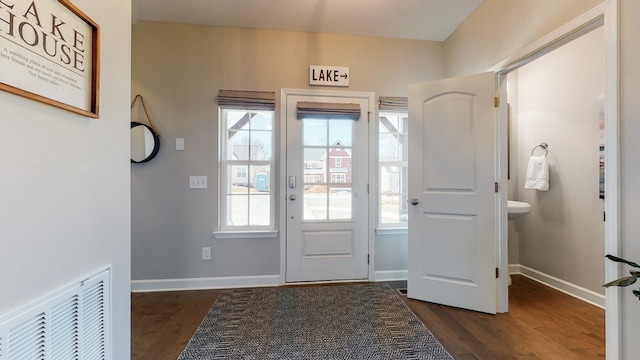 foyer with dark hardwood / wood-style floors