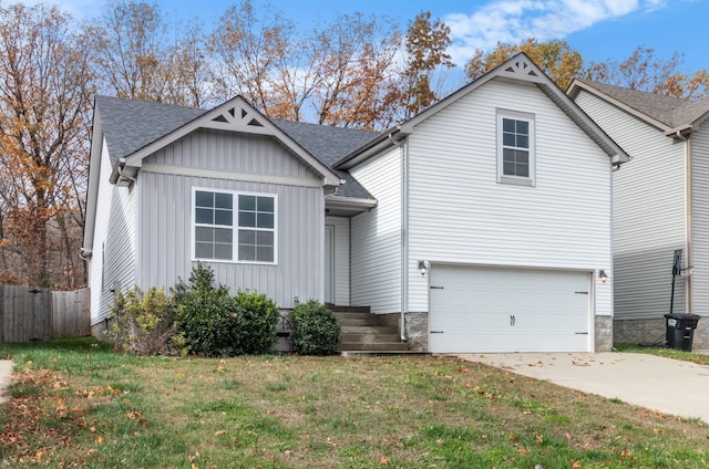 view of front of home featuring a garage and a front lawn