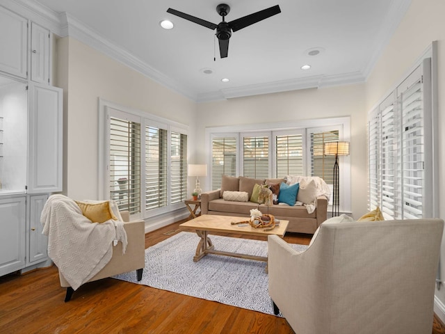 living room with ceiling fan, wood-type flooring, and crown molding