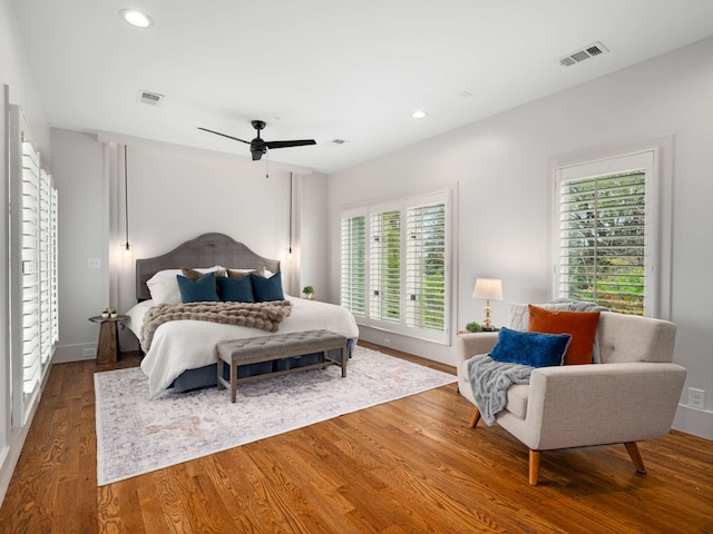 bedroom featuring hardwood / wood-style floors and ceiling fan