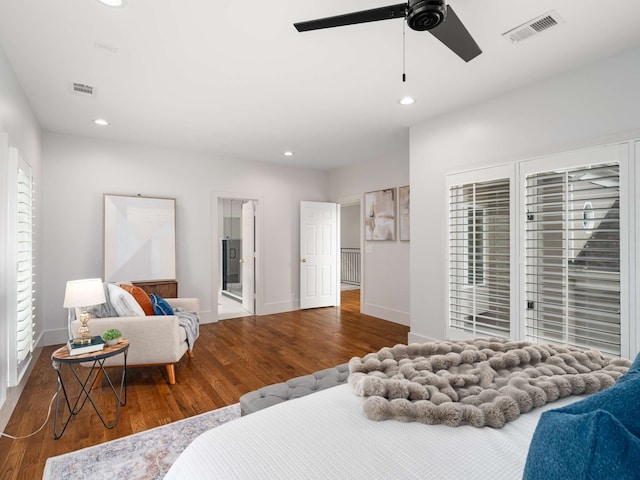 bedroom with dark wood-type flooring, ceiling fan, and multiple windows