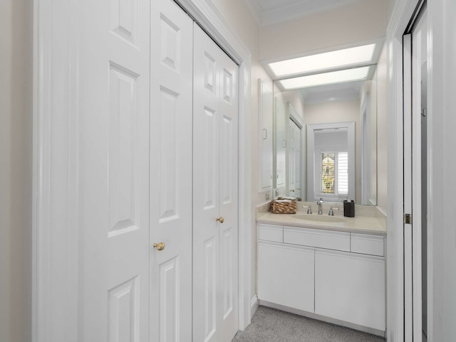 bathroom with a skylight and vanity