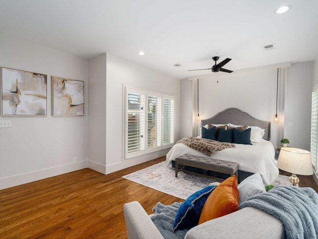 bedroom featuring hardwood / wood-style flooring and ceiling fan