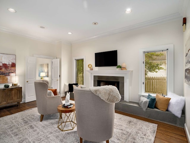 living room featuring dark wood-type flooring and ornamental molding