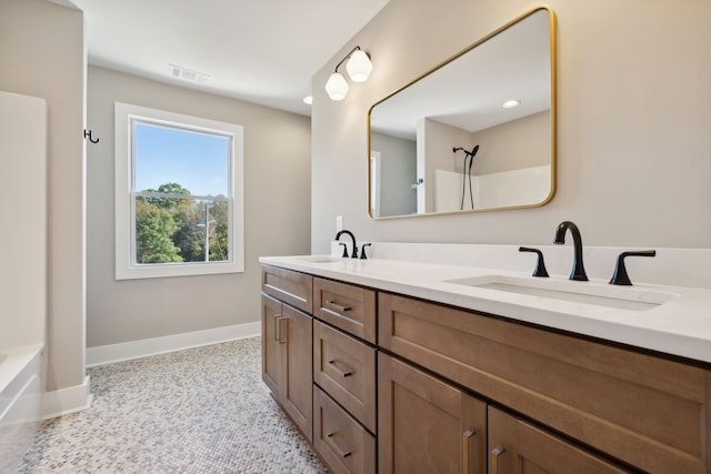 bathroom with vanity and shower / washtub combination