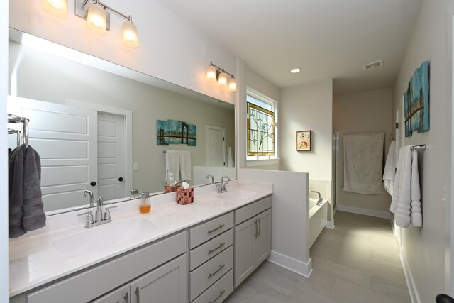 bathroom with a bathtub and vanity