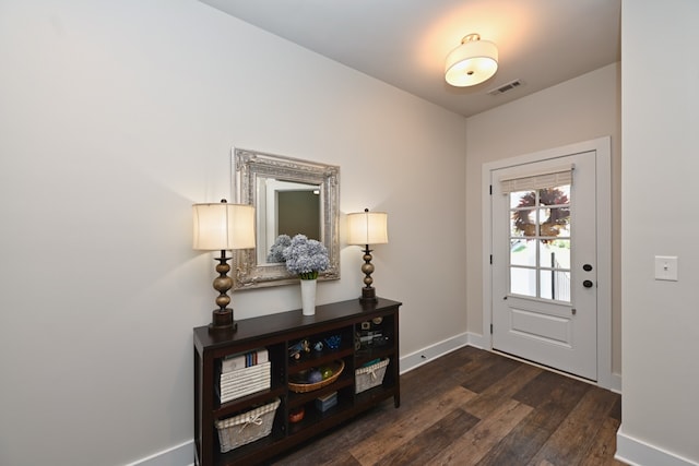 foyer entrance with dark hardwood / wood-style flooring