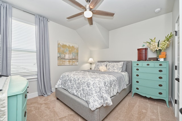 carpeted bedroom featuring lofted ceiling and ceiling fan