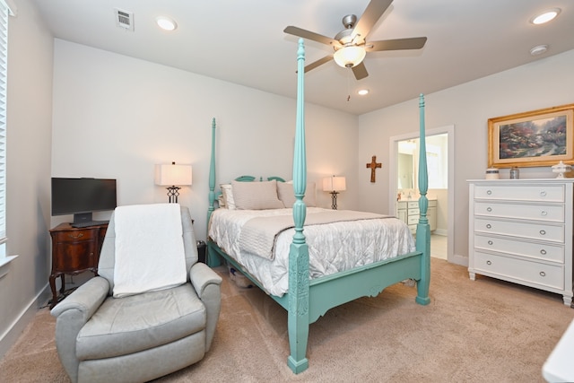 bedroom featuring carpet flooring, ceiling fan, and ensuite bathroom