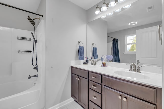 bathroom with tile patterned flooring, vanity, and shower / bath combo with shower curtain