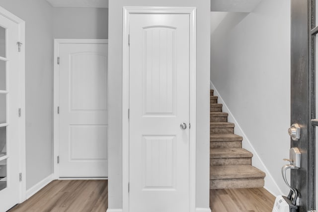 stairway featuring hardwood / wood-style floors