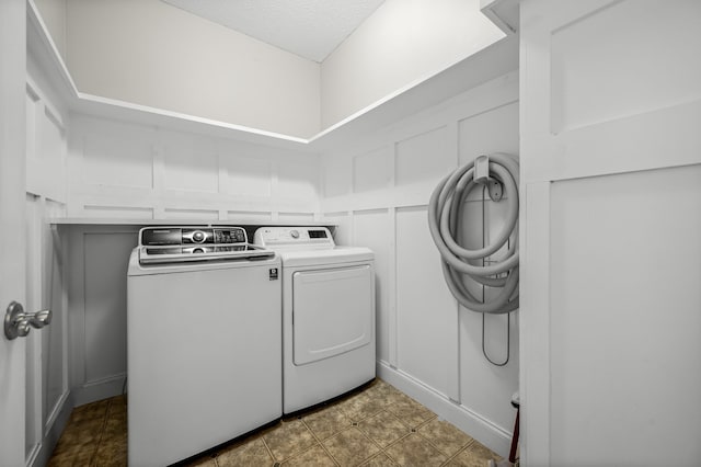 laundry area with independent washer and dryer