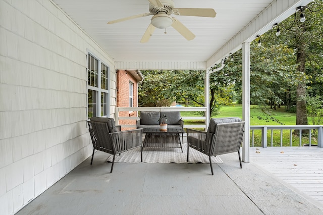 view of patio with a wooden deck and ceiling fan