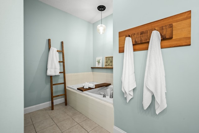 bathroom with tiled bath and tile patterned floors