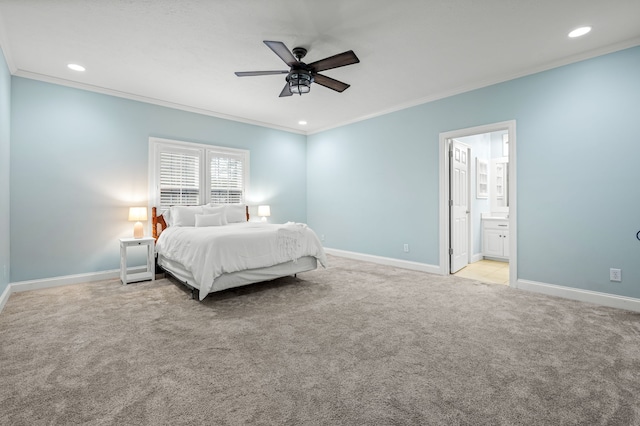 carpeted bedroom featuring ornamental molding, connected bathroom, and ceiling fan