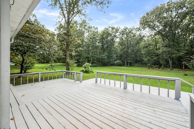 wooden terrace with a lawn