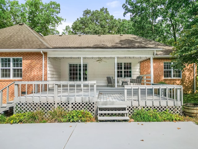 back of property featuring a wooden deck