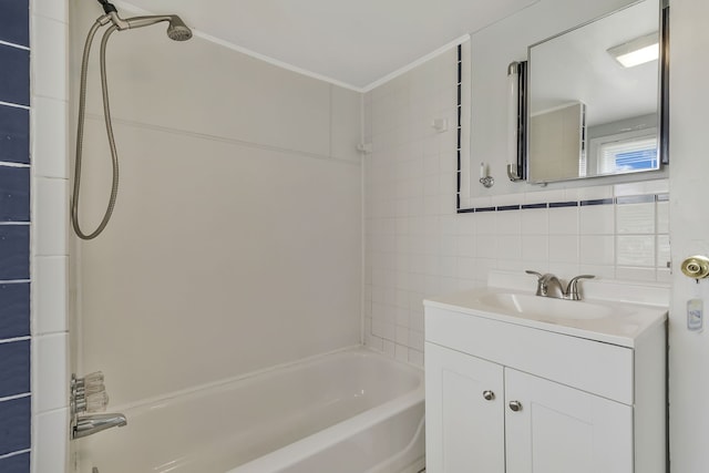 bathroom featuring tile walls, vanity, backsplash, and shower / bathtub combination