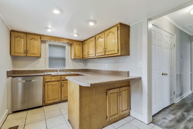 kitchen featuring kitchen peninsula, sink, light tile patterned floors, stainless steel dishwasher, and crown molding